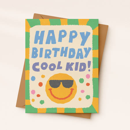 Birthday card with a smiley face wearing sunglasses and 'Happy Birthday Cool Kid!' text on a colorful border.