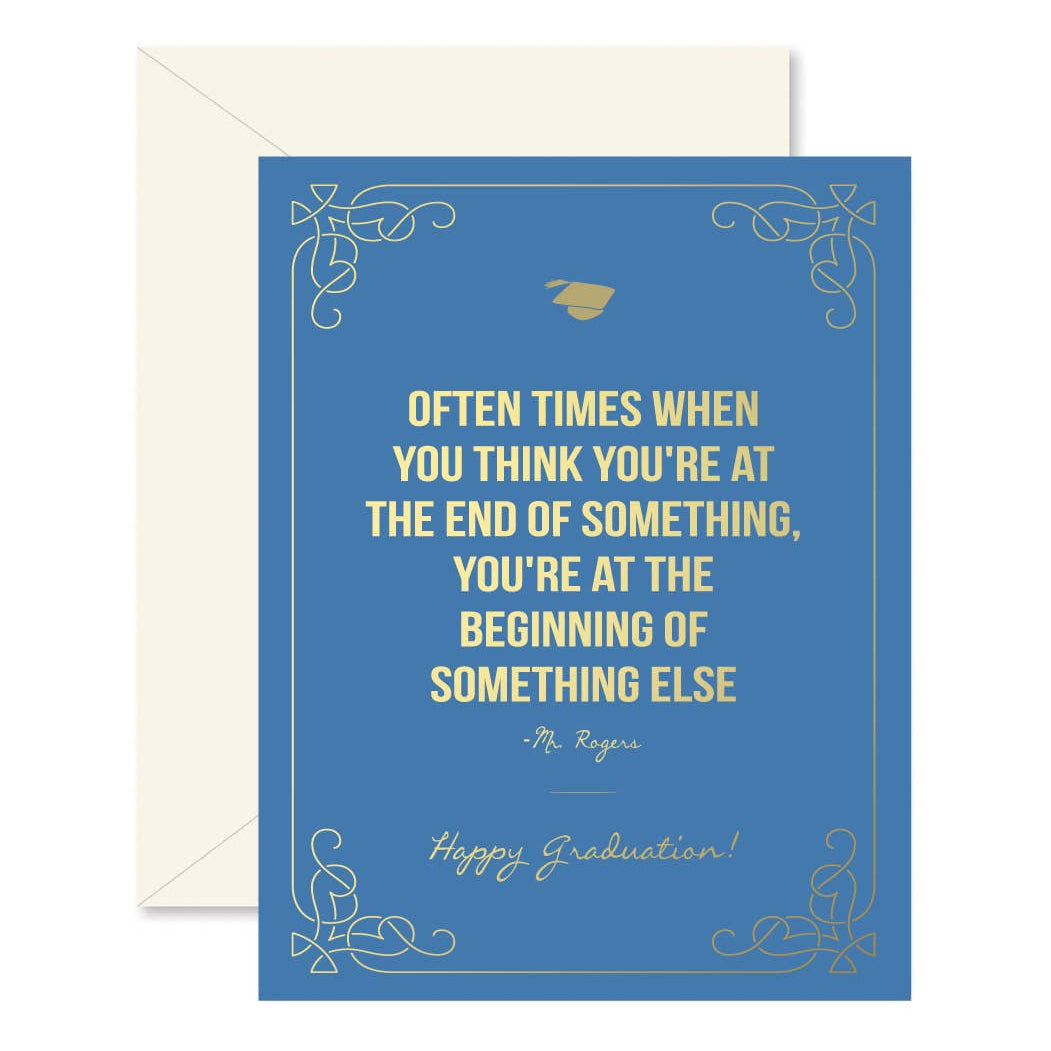 A blue folding greeting card with a quote from Mr. Rogers, featuring gold foil accents, a graduation cap icon, and a white envelope.