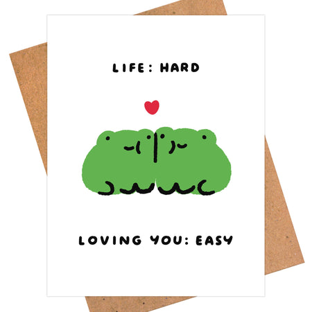Card with green frog illustration and text 'Life: Hard, Loving You: Easy' on a white background.
