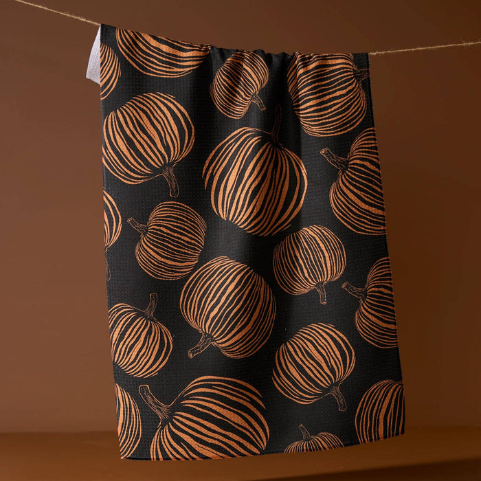 Towel with pumpkin pattern on a brown background