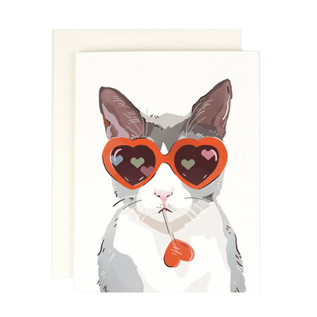 Greeting card with a cat wearing heart-shaped sunglasses on a white background