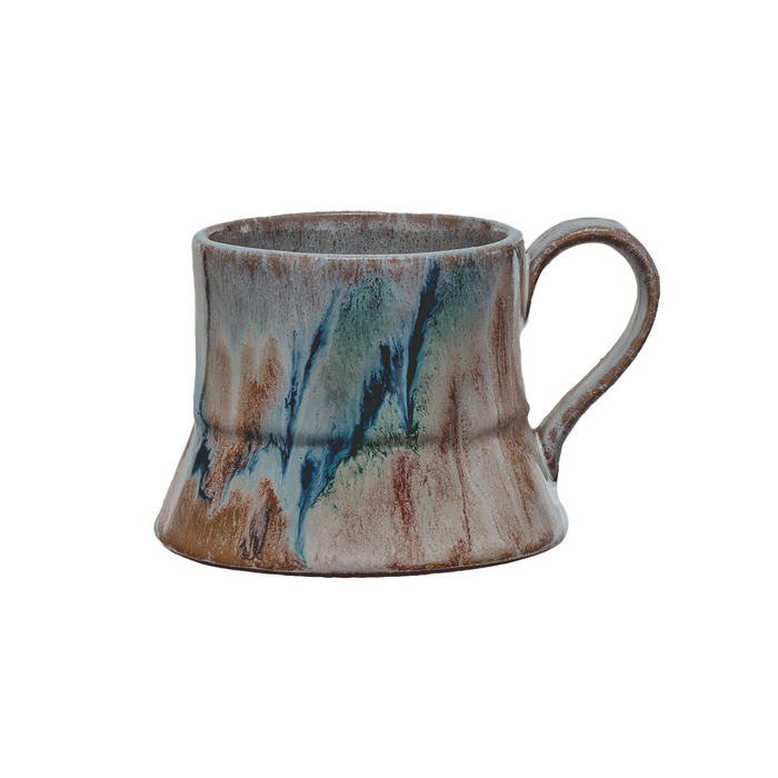Ceramic mug with multicolored glaze on a white background