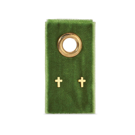 cross earrings on a green velvet card