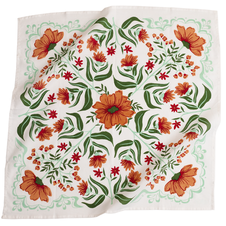 Floral patterned fabric with orange and red flowers on a white background