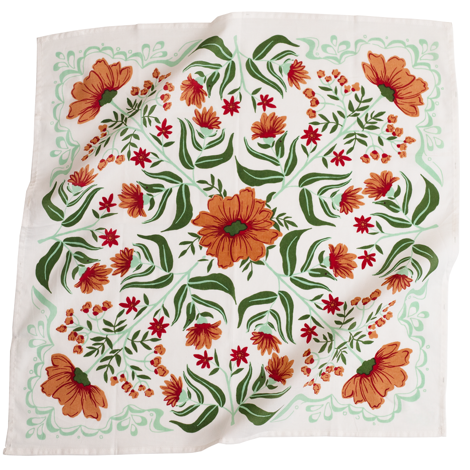 Floral patterned fabric with orange and red flowers on a white background