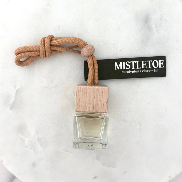 Mistletoe car air freshener on a marble surface