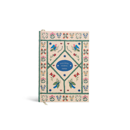 Wellness journal with decorative cover featuring birds and flowers on a white background