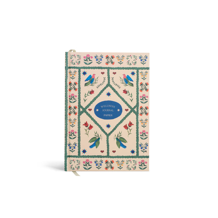 Wellness journal with decorative cover featuring birds and flowers on a white background