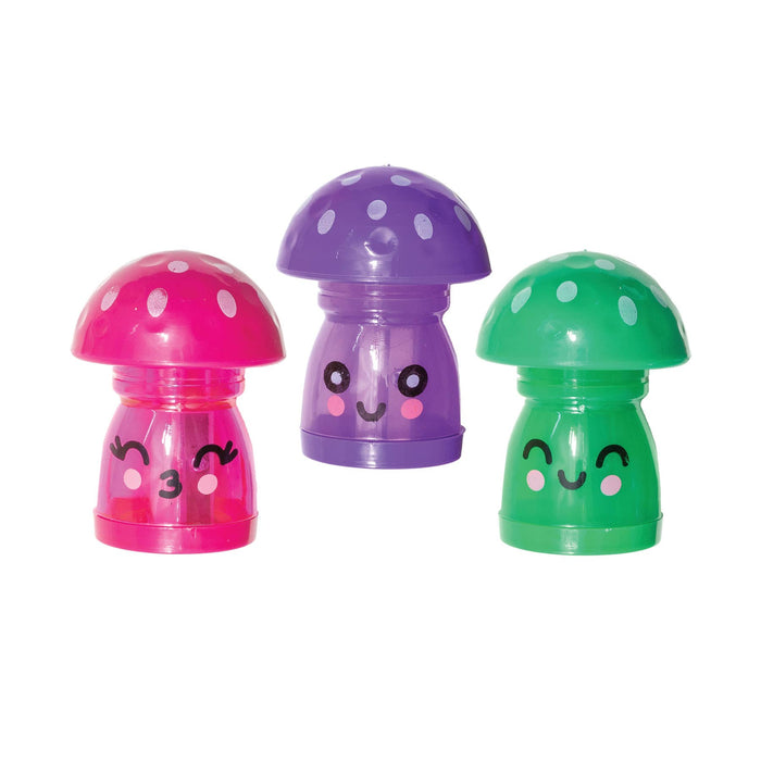 Three colorful mushroom-shaped sharpener/erasers with smiling faces on a white background