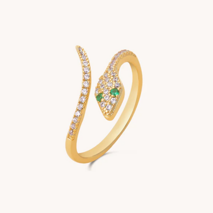 Gold snake shaped ring with green gemstone on a white background