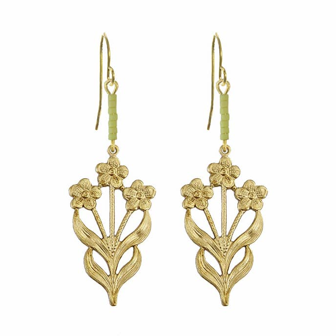 Gold floral earrings on a white background