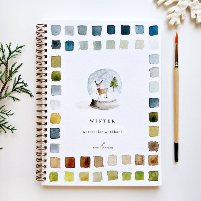 Winter watercolor workbook with a snow globe design on a white background