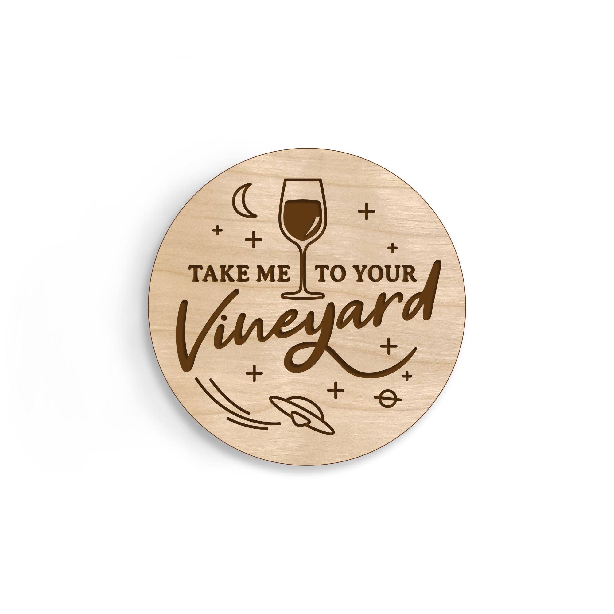 Wooden magnet with 'Take me to your Vineyard' text and wine glass illustration on a white background