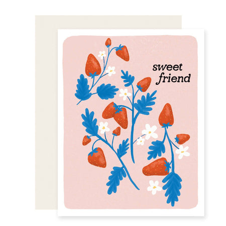 Greeting card with strawberry design and 'sweet friend' text on a pink background