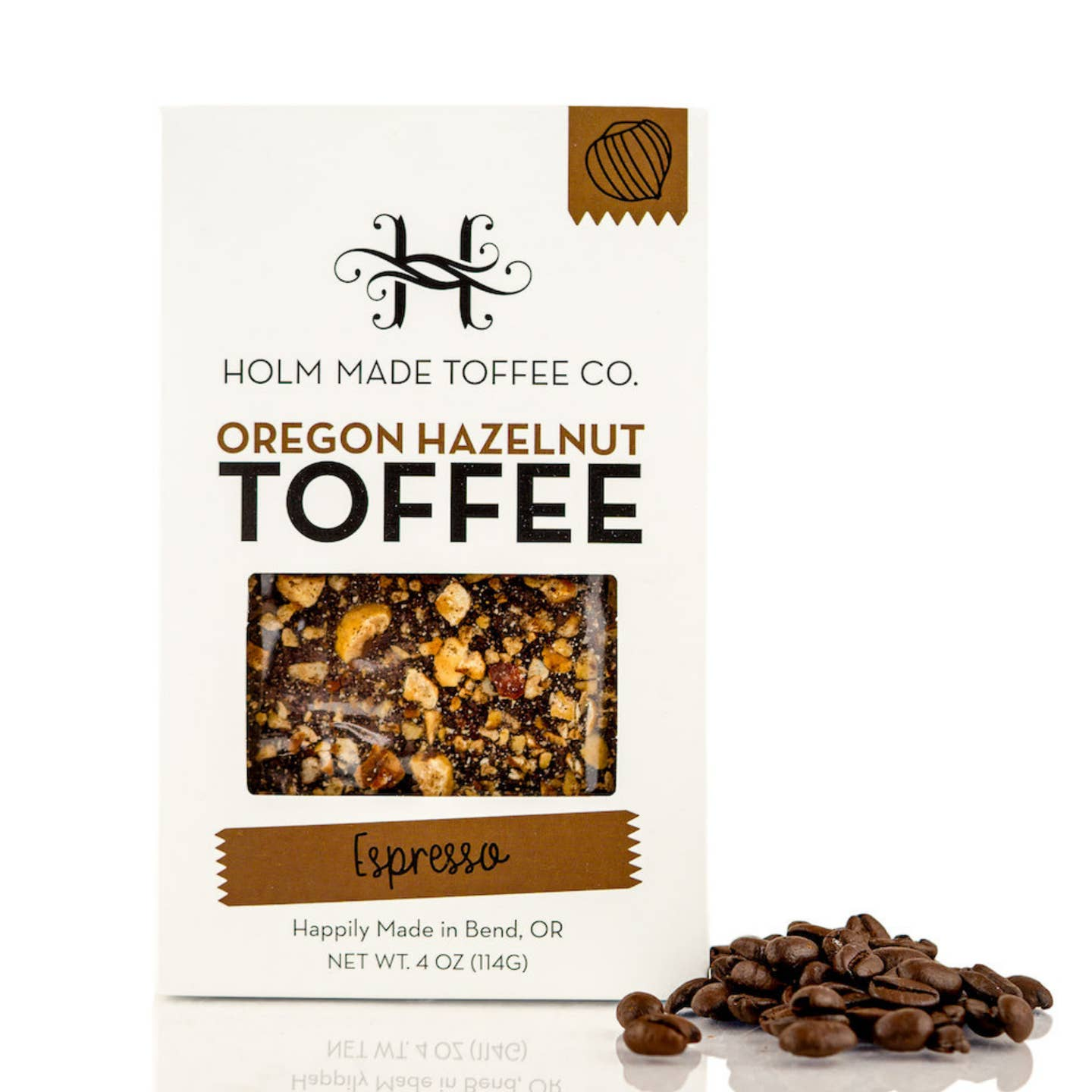 Holm Made Toffee Co. Oregon Hazelnut Toffee package with coffee beans on a white background