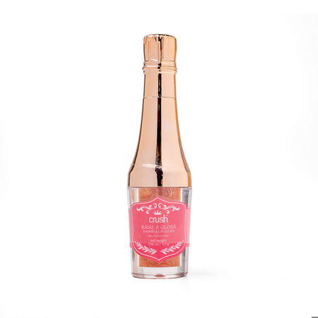 Rose gold lip gloss with a pink label on a white background