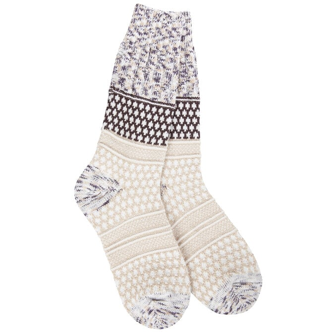 A pair of crew socks with a multi-colored knit pattern, featuring cream, white, and dark brown sections with geometric and floral motifs, shown against a plain white background.