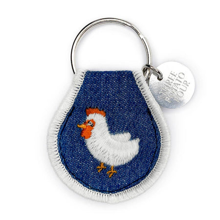 Keychain with embroidered chicken design on a blue background