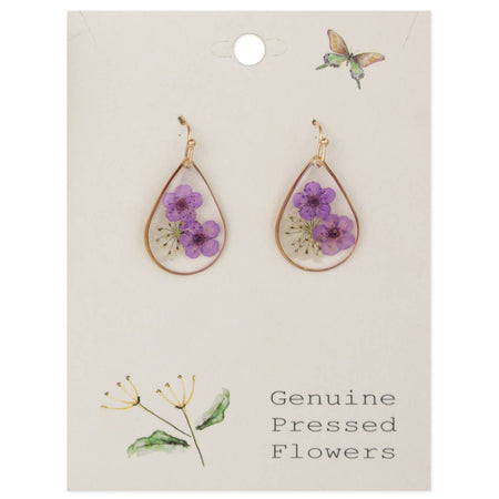 Teardrop-shaped earrings with purple flowers on a card labeled 'Genuine Pressed Flowers'.