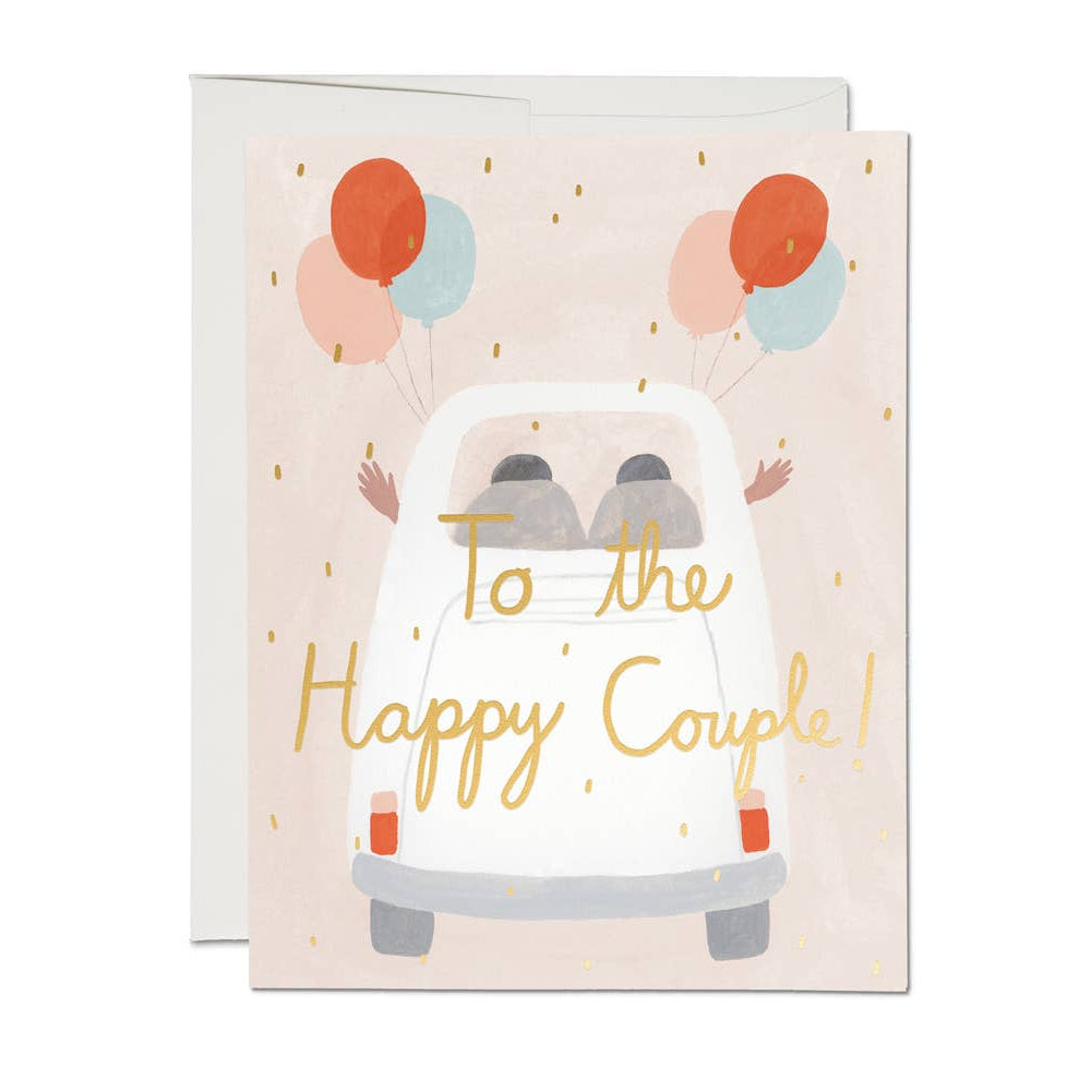 Greeting card with a card illustration and balloons, featuring the text 'To the Happy Couple!'.