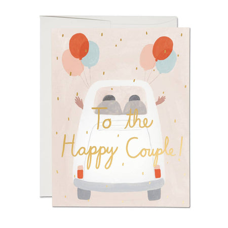 Greeting card with a card illustration and balloons, featuring the text 'To the Happy Couple!'.