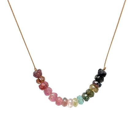 Necklace with multicolored gemstone beads on a white background