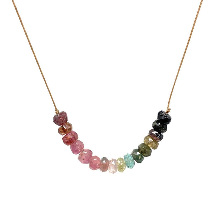Necklace with multicolored gemstone beads on a white background