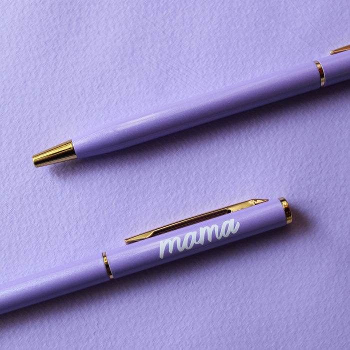 Two purple pens on a purple background, one with 'mama' engraved.