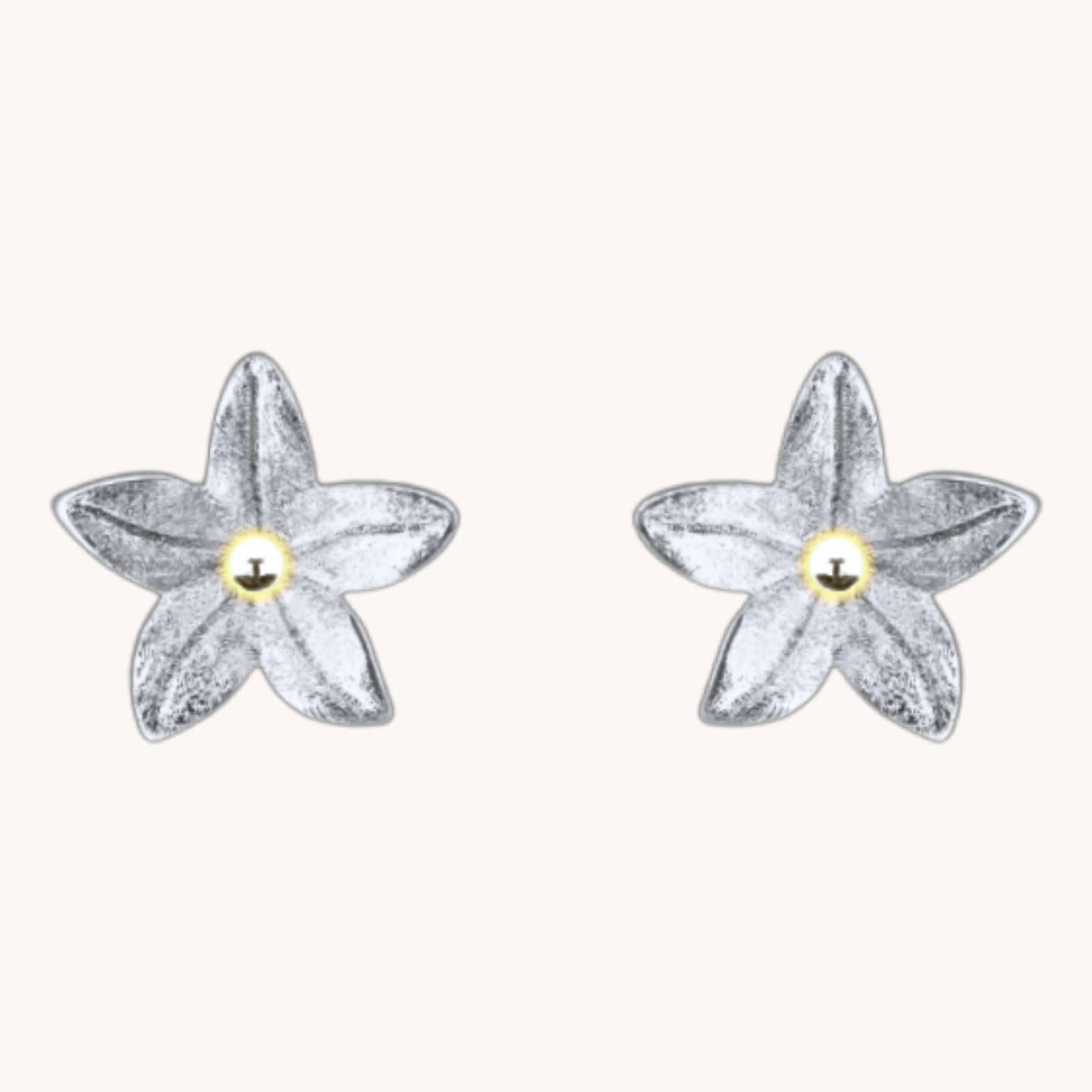 Pair of Summer Lily Silver Studs with five silver-tone petals and small gold-tone centers.
