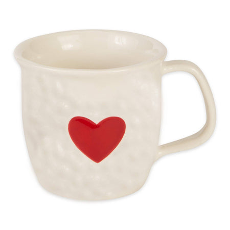 An off-white textured ceramic mug with a glossy red heart printed on the front, set against a plain white background.