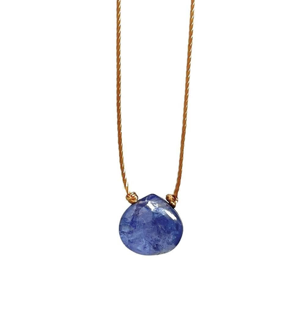 A smooth teardrop-shaped Tanzanite gemstone necklace with a light brown hand-knotted cord and a sterling silver clasp.