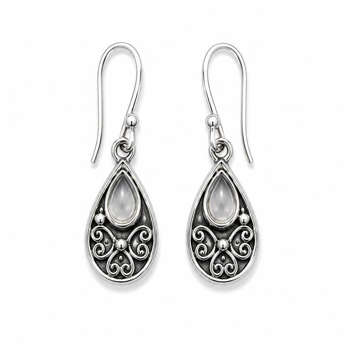A pair of silver-toned teardrop dangle earrings with ornate filigree detailing and a small teardrop-shaped clear stone at the top of each earring, shown on a plain white background.