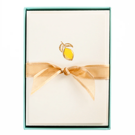 notecard set with a lemon design packaged with a gold ribbon on a white background