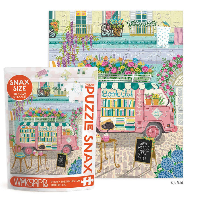 Snax Size puzzle packaging with a pink bookmobile and floral decorations on a white background