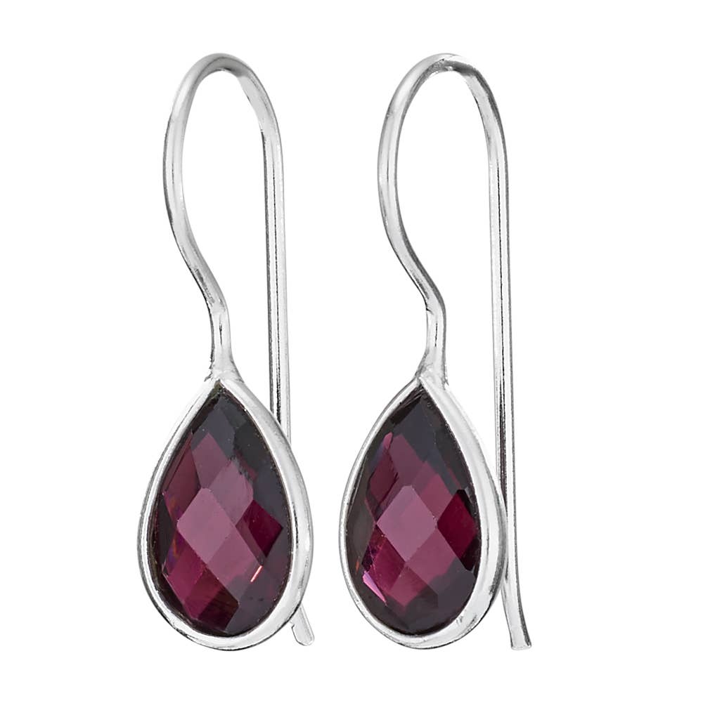 Silver earrings with teardrop-shaped red gemstones on a white background