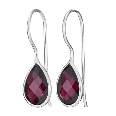 Silver earrings with teardrop-shaped red gemstones on a white background