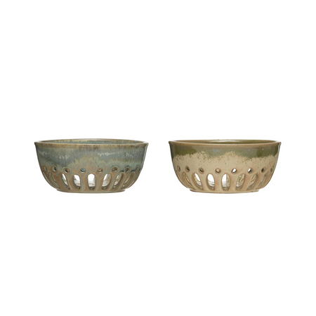 Two stoneware berry bowls with perforated designs on a white background