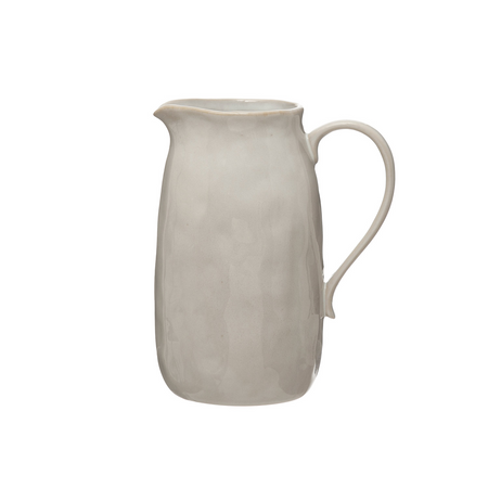 White ceramic pitcher on a white background