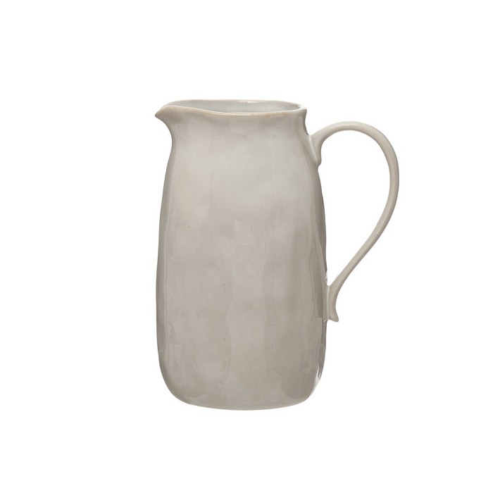 White ceramic pitcher on a white background