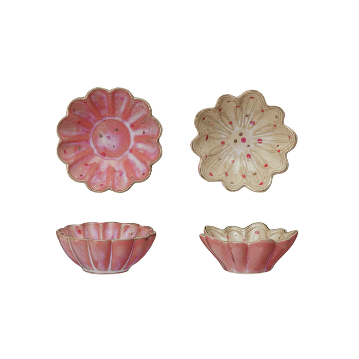 Two pink ceramic bowls with floral designs on a white background