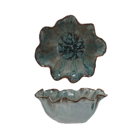 ceramic bowls with reactive glaze and scalloped edges on a white background
