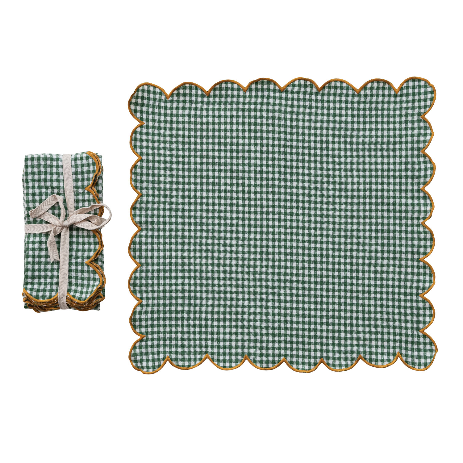 Green checkered placemat with scalloped edge and matching folded napkin on a white background