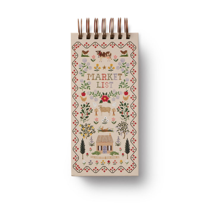 Small notebook with decorative cover and 'Market List' text on a white background