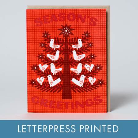 Red greeting card with a tree and birds design, labeled 'Season's Greetings', on a light gray background.