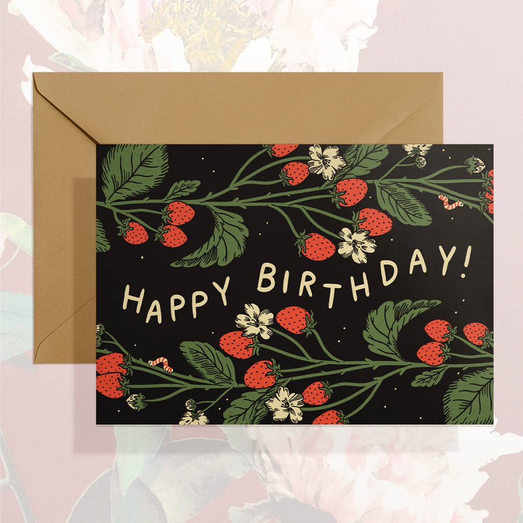 Greeting card with strawberry design and 'Happy Birthday!' text, featuring a brown envelope on a floral background.