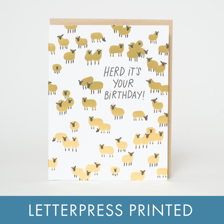 Greeting card with sheep pattern and 'Herd it's your birthday!' text on a white background