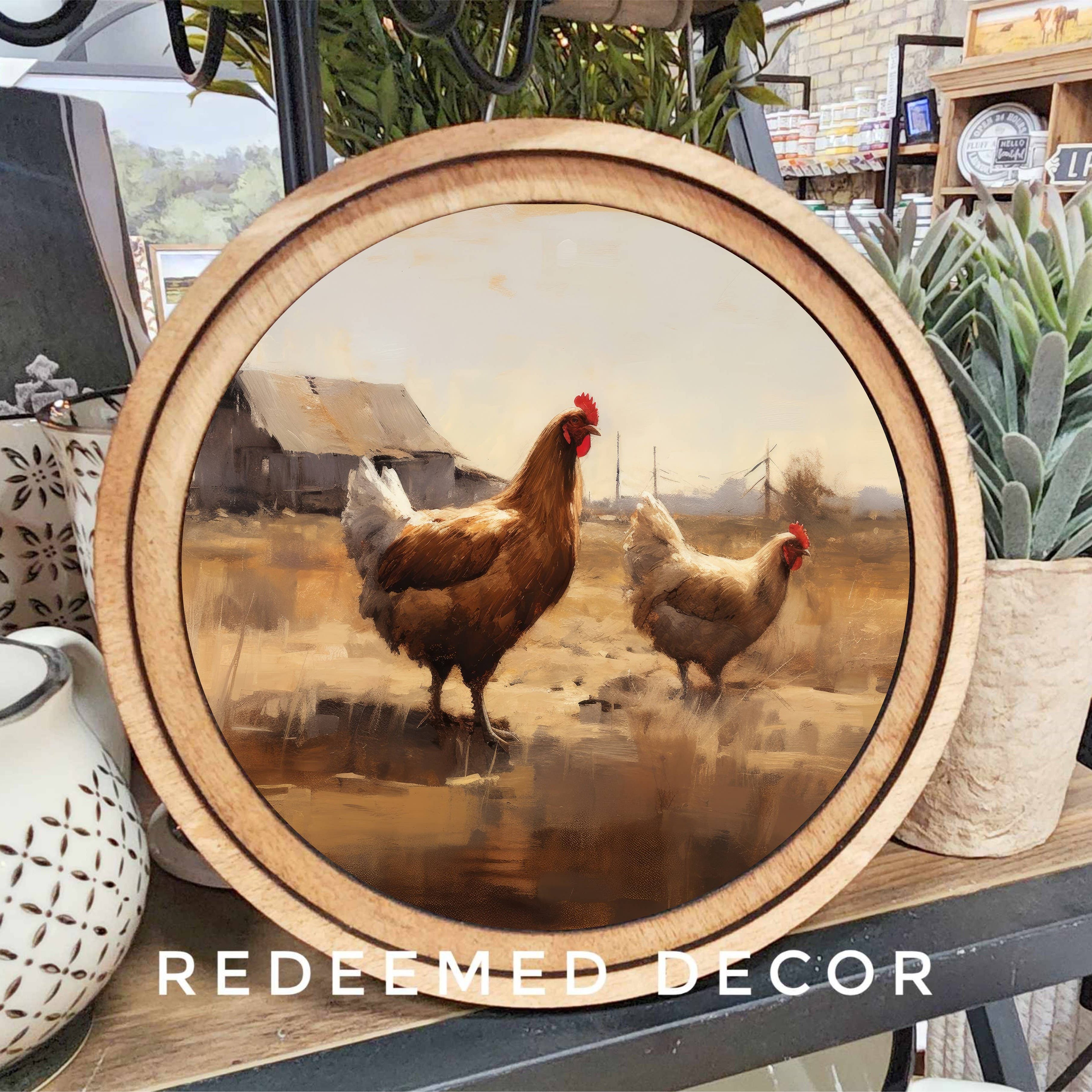 Decorative wall art with two chickens in a wooden frame, labeled 'Redeemed Decor'.