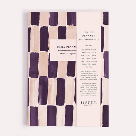 Daily planner with purple and beige abstract pattern on a white background