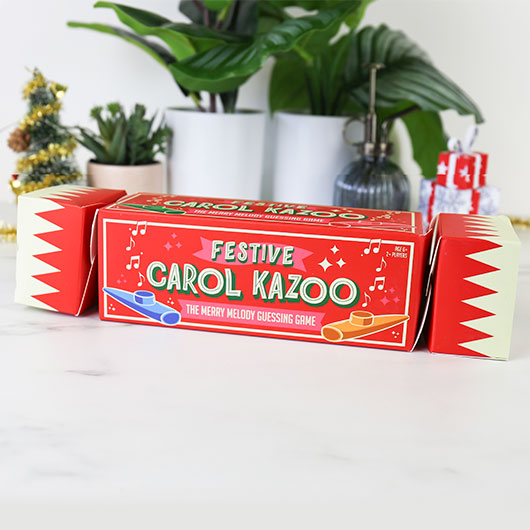 Festive Carol Kazoo guessing game on a white surface