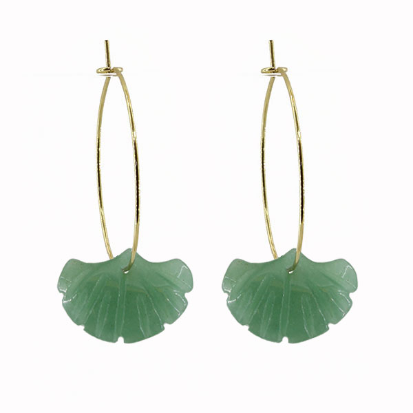 Green leaf-shaped earrings on gold hoop wires against a white background